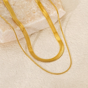 Double layered gold snake bone chain necklace in stainless steel with a minimalist finish