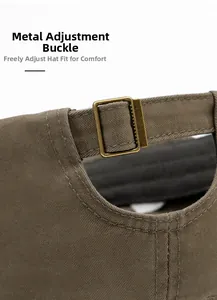 Detail of adjustable vintage bronze metal buckle on cotton military flat top cap