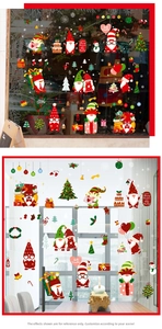 Detailed view of Christmas window gnome stickers with festive gold glitter texture