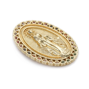 Macro shot of 14K gold plated Virgin Mary pendant with colorful zircon heart frame