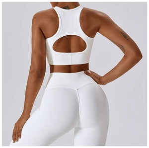 Detailed back view of white ribbed sports bra and high-waisted yoga leggings