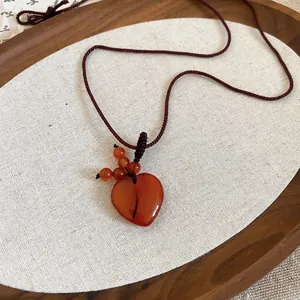 Natural red agate heart pendant necklace with vintage hand-woven brown cord