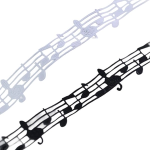 Detail of musical note lace ribbon in black and white for elegant gift box packaging
