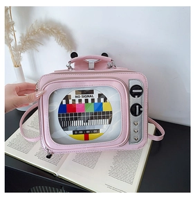 Detailed view of pink retro TV bag with colorful signal screen and silver knobs