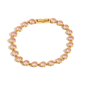 Close-up of gold stainless steel bracelet with pink round cubic zirconia stones