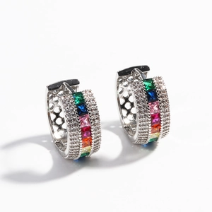 Minimalist silver huggie earrings with colorful rainbow zircon stones in a geometric design