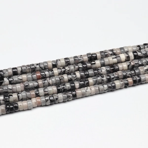Close-up of mixed natural stone heishi spacer beads in assorted colors for jewelry