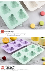 Stack of colorful bear silicone molds with hanging holes for easy kitchen storage