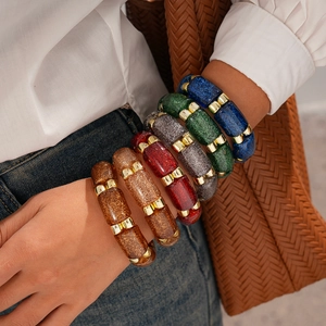 Ethnic acrylic geometric round bracelet set with glitter finish and gold metal accents