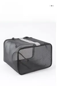 Detail of black mesh bath storage bag with breathable fabric and top handle