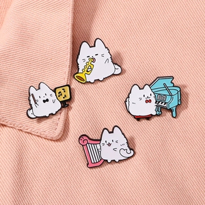Cute cartoon cat musician enamel pins playing instruments on pink denim fabric background