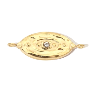 Detailed view of a gold-plated oval pendant with a centered sparkling zircon stone