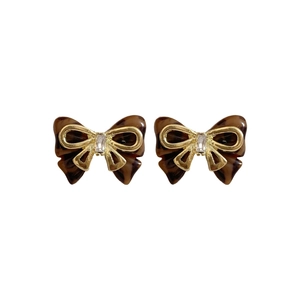 Elegant gold bow earrings with brown tortoiseshell wings and clear zircon center