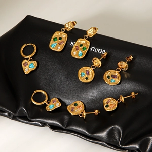 Gold geometric earrings set with colorful gemstones including heart and rectangle shapes