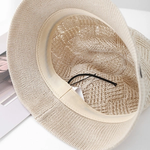 Close-up of knit bucket hat interior with sweatband and adjustable drawstring