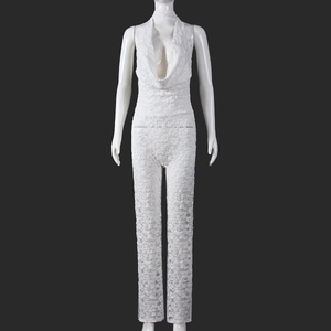Detailed view of white floral lace texture and deep V-neck halter design on jumpsuit