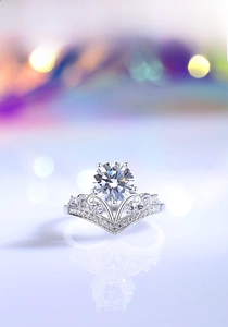Close-up of crown-shaped S925 silver ring with 2-carat moissanite and bokeh background