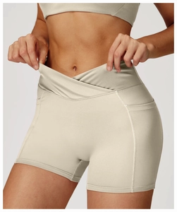 Detail of high-waisted yoga shorts with V-cross waistband and side pockets