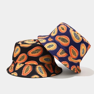 Black and navy cotton bucket hats with vibrant tropical papaya prints for sun protection