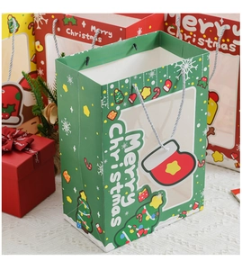 Detailed view of Christmas gift bags with transparent window and cotton handles