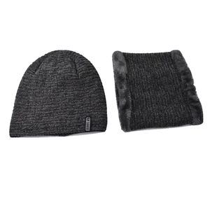 Dark grey knitted beanie and neck warmer set with faux fur lining and brand label