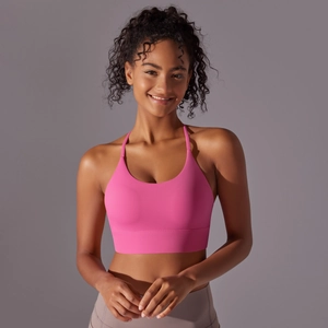 Close-up of hot pink halter yoga bra with seamless wide band and thin straps