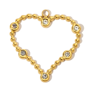 Close-up of golden heart pendant with beaded edge and sparkling crystal accents
