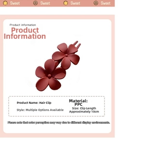 Vue détaillée d'une pince à cheveux fleur rouge mat de 10cm en matériau PPC durable