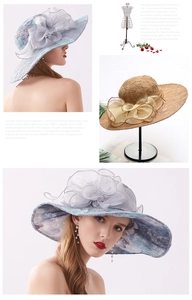 Detail of organza sun hat with oversized lace floral decoration and wide brim style