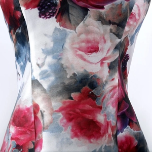 Floral print evening dress with red and pink blossoms and elegant fishtail V-neck cut