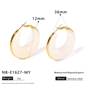 Detail of gold stainless steel and white resin hoop earrings with dimensions and weight