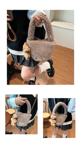 Detail of brown faux fur bucket bag with plush bear charm and woven label detail