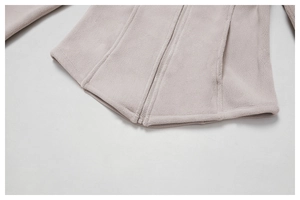 Detailed texture of thick fleece jacket fabric with full metal zipper and side pockets