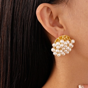 Close-up of French vintage large cluster pearl earrings with elegant gold setting