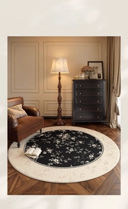 Detail of artistic round carpet with black and white floral pattern in a vintage room