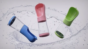 Detail view of portable pet water bottle features leak-proof lock and water splash effect