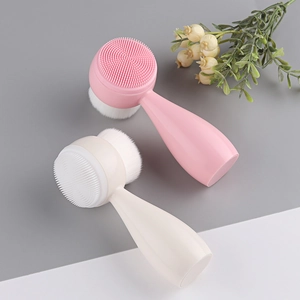 Close-up of dual-sided facial cleansing brush with soft bristles and silicone massage head