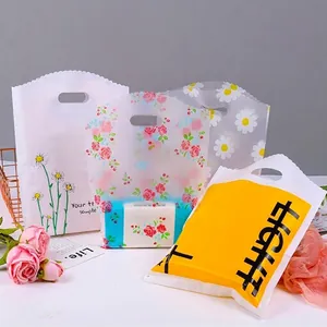 Frosted floral plastic gift bags with wave-cut edges and oval handles for packaging
