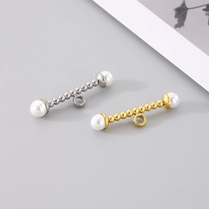Detail of gold and silver plated stainless steel OT toggle clasps with white bead accents