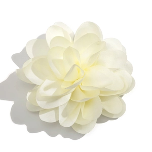 Macro shot of layered cream chiffon flower brooch showing delicate petal textures