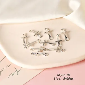 Detailed view of silver cross jewelry connectors sized 8x20mm for DIY earring making