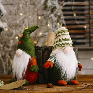Pair of festive knitted Christmas gnomes with long white beards and cozy plush hats