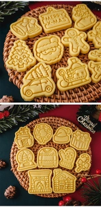 Detail of golden Christmas cookies in Santa, tree, and gingerbread man shapes on a tray
