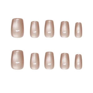 Short square press-on nails in light champagne pearlescent finish on white background