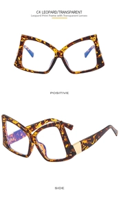 Detail view of leopard print butterfly glasses frame with gold hardware accents