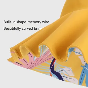 Yellow sun hat with wide brim, tropical floral print lining and adjustable memory wire shape