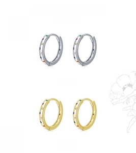 Detail view of gold and silver S925 sterling silver hoop earrings with rainbow gemstones