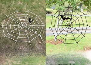 Detailed outdoor view of 2.5m giant Halloween spider web in black and white colors