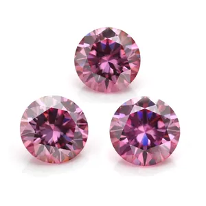 Macro shot of three round brilliant cut pink moissanite stones with hearts and arrows