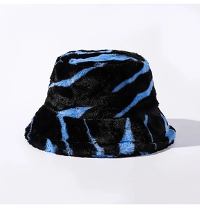Detailed view of the thick faux fur plush texture and blue zebra print bucket hat